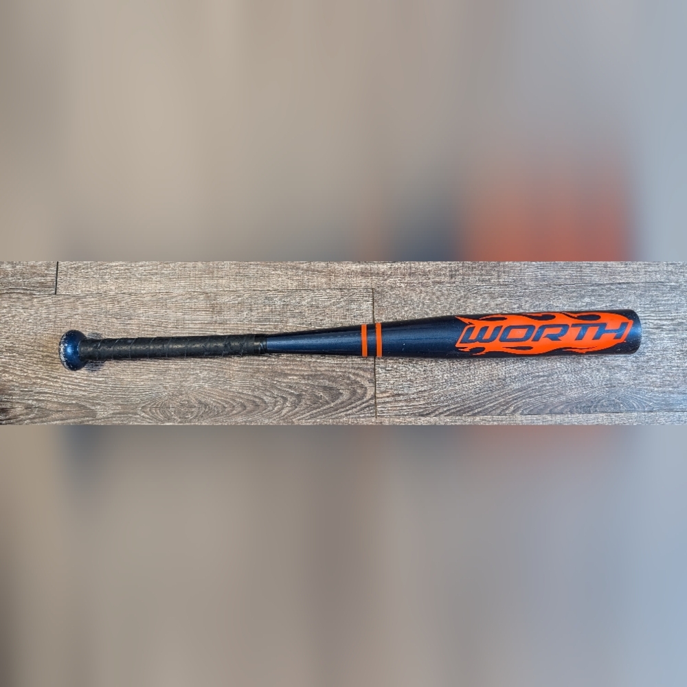 Worth 25" TBall Bat with Vibrant Orange and Blue Design.